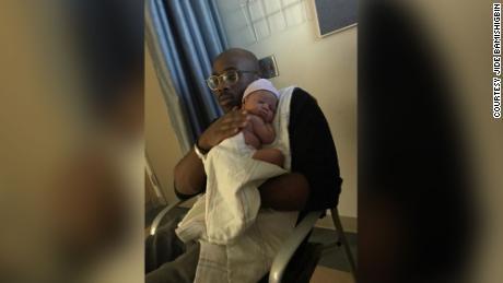 Olajide N. Bamishigbin Jr. in the hospital with his second son, born in February 2018.