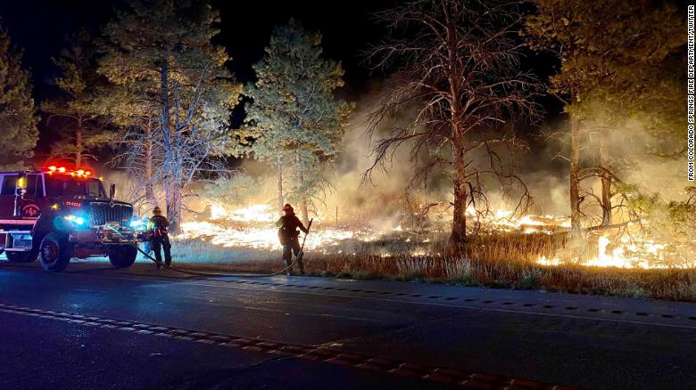 A Colorado wildfire jumped a highway and is now burning on an Army base