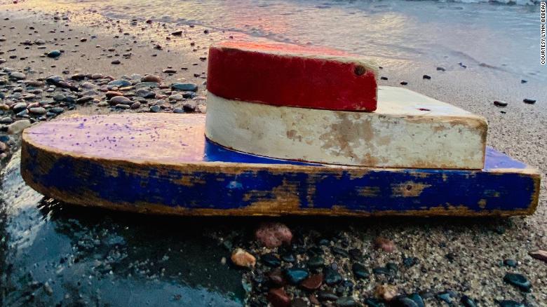 A tiny boat was discovered on a remote beach 27 years after it was launched by teachers