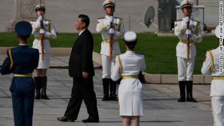 Chinese President Xi Jinping walks to the Monument to the People&#39;s Heroes during a wreath laying ceremony to honour deceased national heroes on Martyrs Day in Beijing&#39;s Tiananmen Square on September 30.