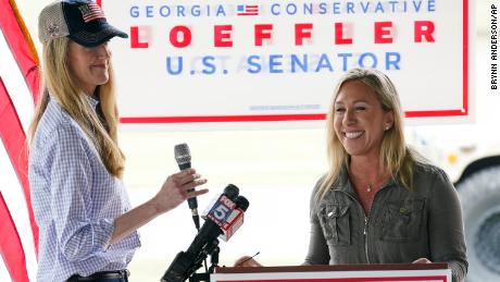Republican congressional candidate Marjorie Taylor Greene, right, introduces Sen. Kelly Loeffler, during a news conference on Thursday in Dallas, Georgia.