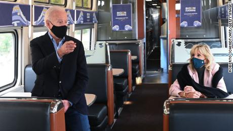 Democratic presidential nominee Joe Biden, with Jill Biden, speaks to voters as he rides a train approaching the Alliance Train Station in Alliance, Ohio.