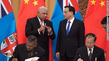 Fiji&#39;s Prime Minister Josaia Voreqe &quot;Frank&quot; Bainimarama talks with Chinese Premier Li Keqiang during a signing ceremony at the Great Hall of the People in Beijing on May 16, 2017.