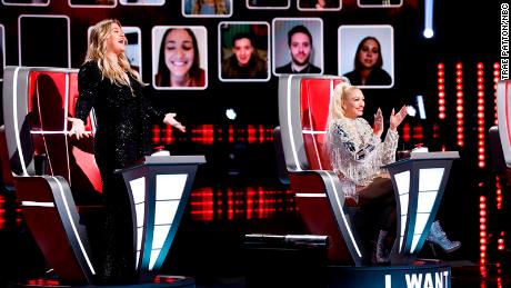 (From left) Kelly Clarkson and Gwen Stefani, joined by a virtual audience, cheered during the so-called &quot;blind auditions&quot; of &quot;The Voice.&quot;