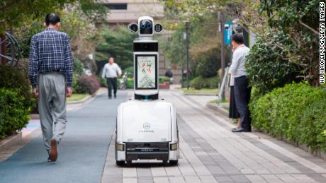 A CloudMinds security guard robot patrols a residential community on October 14 in Jinhua, China.