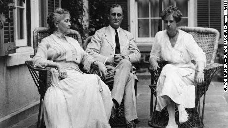 Franklin Delano Roosevelt sits with his wife and mother at their home in Hyde Park, New York, circa 1920.