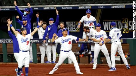 Oct 27, 2020; Arlington, Texas, USA; The Los Angeles Dodgers bench celebrates after right fielder Mookie Betts (50) hit a home run during the eighth inning against the Tampa Bay Rays during game six of the 2020 World Series at Globe Life Field. Mandatory Credit: Kevin Jairaj-USA TODAY Sports