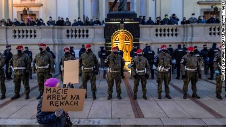 Friday&#39;s protest in Warsaw was the largest Poland has seen in decades as demonstrators wearing face masks and holding placards took to the streets.
