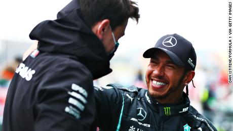 Hamilton with Mercedes chief Toto Wolff. 
