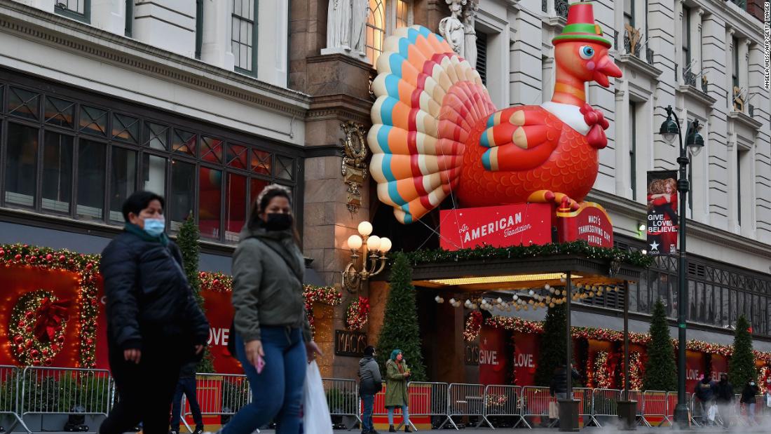 People take photos of Thanksgiving decorations at Macy&#39;s Herald Square store in New York City.