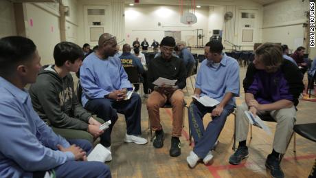 Sy Green, center, and Jason Bryant, right, participate in the reading group.
