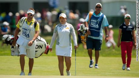 Inbee Park (second left) and her caddie walk down the fairway with  Kim (right) and her caddie during the final round of the 2015 Women&#39;s PGA Championship. 