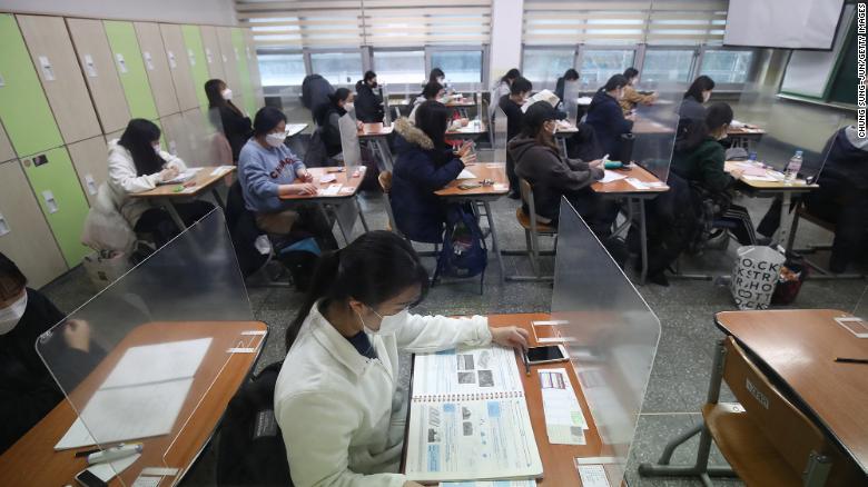 Half a million South Korean students sit a college entrance exam despite rising Covid cases