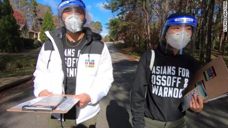 Volunteers Grace Pai and Syed Hussain go door to door to inform AAPI voters about Georgia&#39;s January runoff elections.