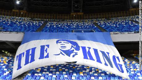 A flag in Napoli&#39;s stadium pays tribute to Maradona.