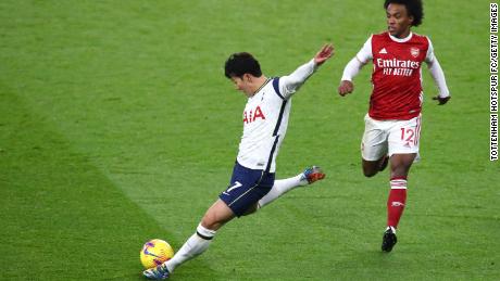 Son scores whilst under pressure from Willian against Arsenal.