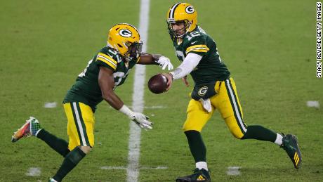 Aaron Rodgers, right, became the quickest quarterback to reach 400 career passing touchdowns on Sunday, doing so in just 193 games.