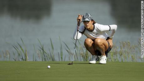 Wie lines up a putt on the 10th green during the first round of the PGA Championship.