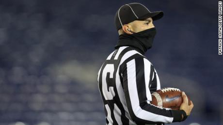 A college football referee wears a face covering due to Covid-19 pandemic during the second half at Navy-Marine Corps Memorial Stadium on November 28, 2020 in Annapolis, Maryland. 