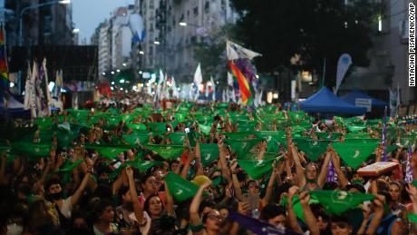 Abortion-rights supporters rally Thursday outside Argentina&#39;s Congress with green handkerchiefs associated with the movement to decriminalize abortion.