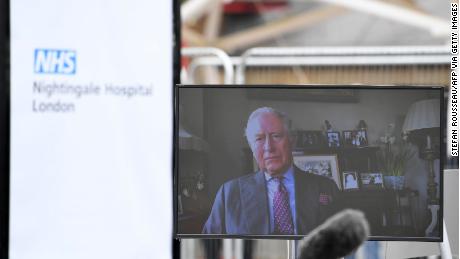 Prince Charles is seen on a monitor as he speaks during the opening of the &quot;NHS Nightingale&quot; field hospital, at the ExCeL London exhibition center, in London on April 3.