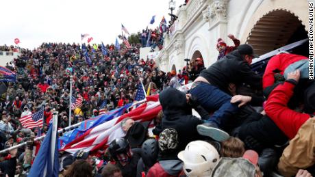Pro-Trump rioters storm the Capitol during clashes with police, following a rally to contest the certification of the 2020 presidential election.