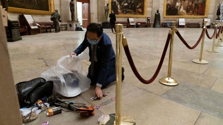 A Congressman got on his knees to pick up trash left after the deadly Capitol riot