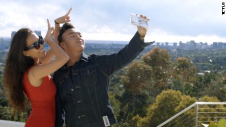 Kelly Mi Li (left) and Kane Lim (right) are shown in a scene from &quot;Bling Empire.&quot; 