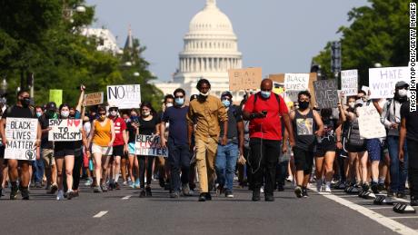 Demonstrators march down Pennsylvania Avenue during a protest against police brutality following the murder of George Floyd, on June 3, 2020, in Washington, DC.