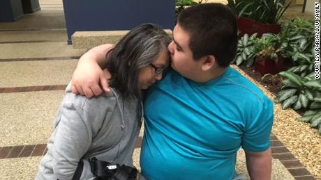 Eric Parsa, left, is seen embracing his mother, Donna Lou.
