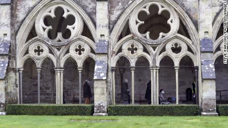 People queue outside Salisbury Cathedral, Wiltshire, to recieve an injection of the Pfizer coronavirus vaccine.