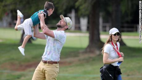 Justin Timberlake lifts up his son Silas next to his wife Jessica Biel at the Crans Montana Golf Club on August 27, 2019 in Crans-Montana, Switzerland. 