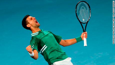 Djokovic lets out a celebratory roar as he defeats Fritz. 