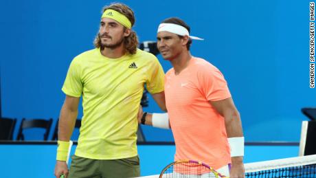 Tsitsipas and Nadal pose prior to their match.