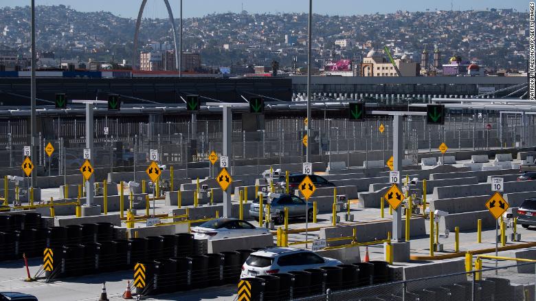 Vehicles enter a checkpoint as they approach the Mexico border at the US Customs and Border Protection San Ysidro Port of Entry at the US- Mexico border on February 19, 2021, in San Diego.