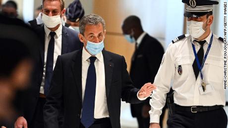 The former French president arrives to hear the final verdict in the corruption trial on Monday.
