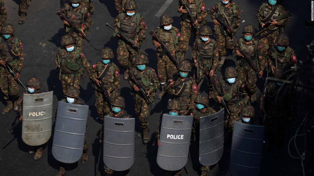 Soldiers patrol during a protest in Yangon on February 28.