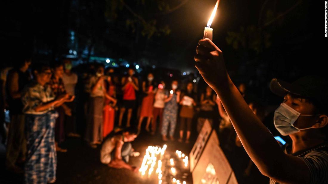 People in Yangon take part in a ceremony on February 28 to remember those who have been killed during demonstrations.