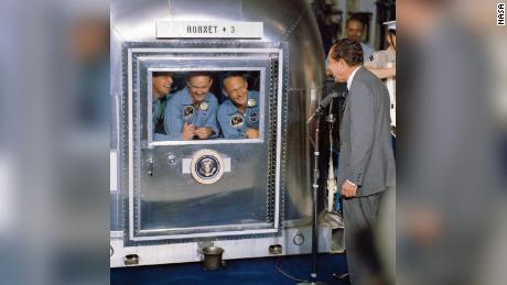 President Richard M. Nixon was in the central Pacific recovery area to welcome the Apollo 11 astronauts aboard the USS Hornet, prime recovery ship for the historic Apollo 11 lunar landing mission. Already confined to the Mobile Quarantine Facility (MQF) are (left to right) Neil A. Armstrong, commander; Michael Collins, command module pilot; and Edwin E. Aldrin Jr., lunar module pilot. Apollo 11 splashed down at 11:49 a.m. (CDT), July 24, 1969, about 812 nautical miles southwest of Hawaii and only 12 nautical miles from the USS Hornet.