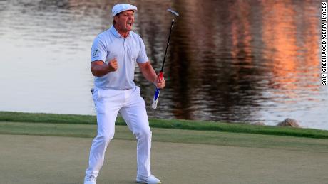 DeChambeau celebrates making his putt on the 18th green to win the Arnold Palmer Invitational.