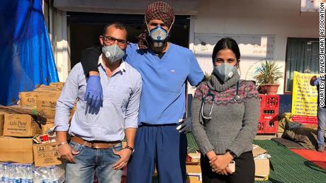 Singh, center, is pictured with other medical team members.