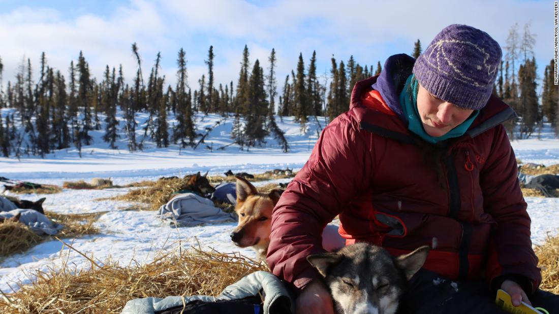 Ryne Olson sits with her 7-year-old dog Dolly, who is named after Dolly Parton, at the Ophir checkpoint on Wednesday, March 10.