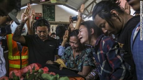 Relatives and friends react during the funeral procession of Ko Saw Pyae Naing, 21, who died in the anti-coup protests, in Mandalay, Myanmar, on March 14. 