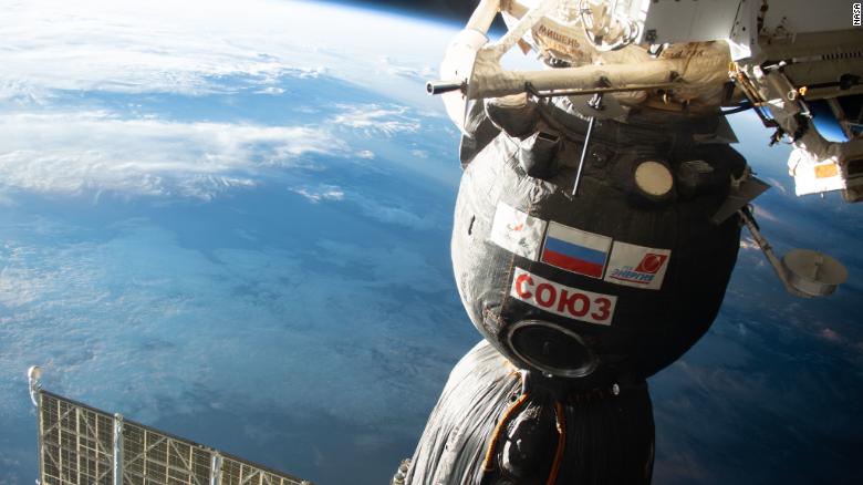 Watch astronauts relocate a spacecraft outside the International Space Station