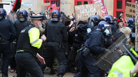 Protesters and police clash during the event.