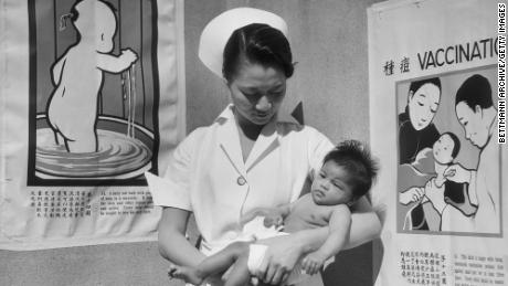 Nurse Minnie Sun holds a baby in 1933 at San Francisco&#39;s Chinese Hospital, the first Chinese-American health care in the continental US.  