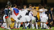 Korea players celebrate after defeating Japan during the men&#39;s bronze medal play-off match between Korea and Japan at the London 2012 Olympics.