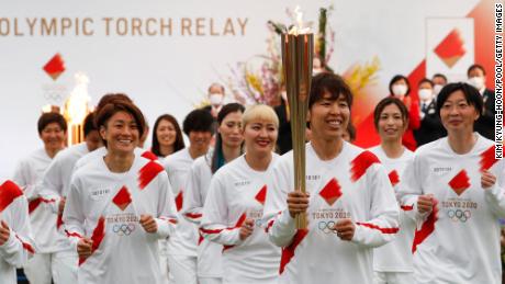 The Olympic flame starts its final leg to Tokyo. Some suggest this day should never have come