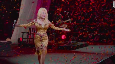 The legendary singer is shown in a scene from &quot;Dolly Parton: A MusicCares Tribute&quot; on Netflix.