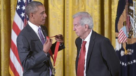 President Barack Obama presents the 2014 National Humanities Medal to writer Larry McMurtry during a ceremony in the East Room of the White House on September 10, 2015.